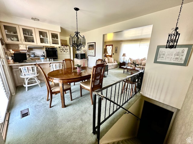 1208 Valhalla Dr, Clearfield, UT 84015 - dining space featuring light carpet and a chandelier