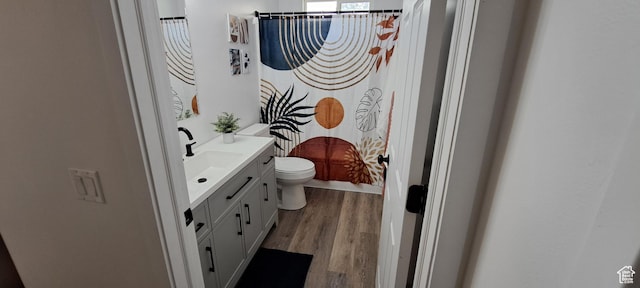 1496 N Monroe, Ogden, UT 84404 - bathroom with vanity, wood finished floors, and curtained shower