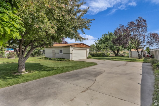 2487 W 1300 N, Clinton, UT 84015 - view of home's exterior with driveway and a storage unit
