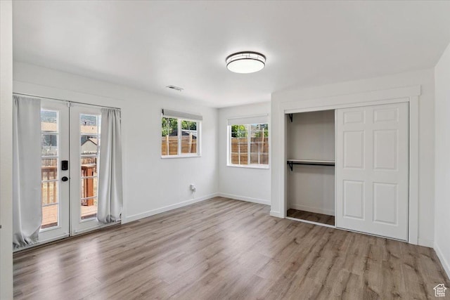 321 E 1040 N, Orem, UT 84057 - unfurnished bedroom featuring wood finished floors, access to exterior, french doors, and a closet