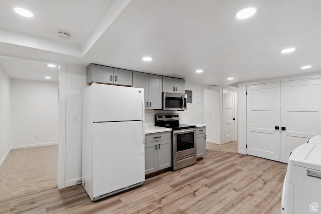 321 E 1040 N, Orem, UT 84057 - kitchen with appliances with stainless steel finishes, gray cabinets, washer / clothes dryer, light wood-style floors, and recessed lighting
