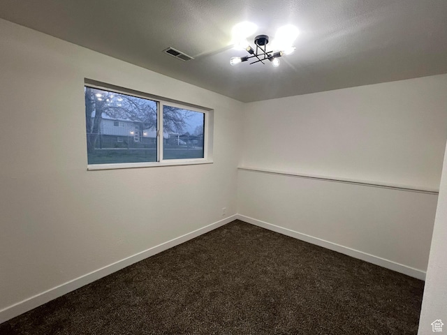 6770 W 3860 S, West Valley City, UT 84128 - unfurnished room featuring dark colored carpet and a chandelier