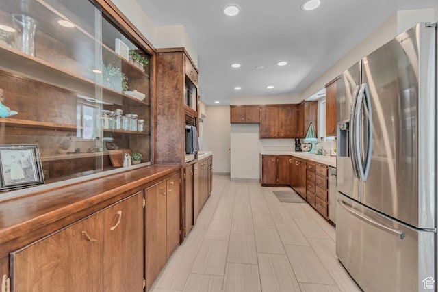 152 N 1350 E, Springville, UT 84663 - kitchen featuring appliances with stainless steel finishes, recessed lighting, brown cabinetry, open shelves, and glass insert cabinets