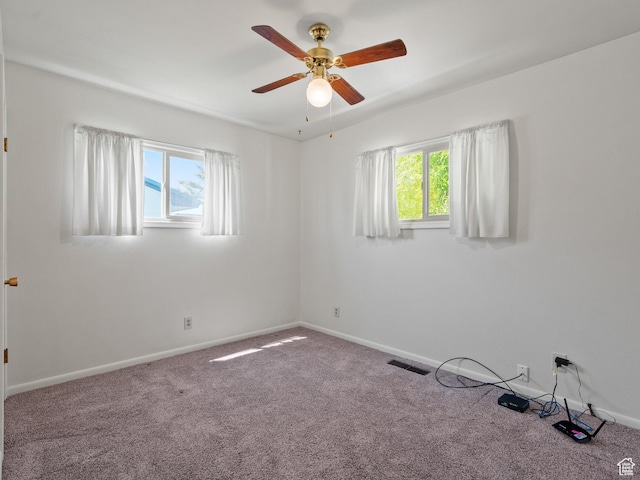 320 S 2nd St W, Soda Springs, ID 83276 - empty room with plenty of natural light, a ceiling fan, and carpet flooring