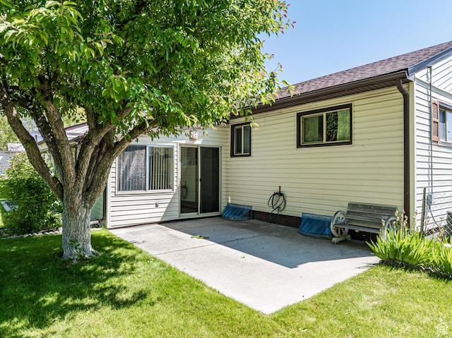 320 S 2nd St W, Soda Springs, ID 83276 - back of property with a patio and a lawn