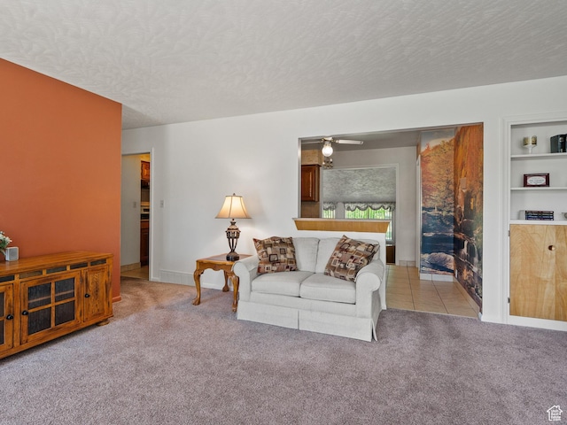 320 S 2nd St W, Soda Springs, ID 83276 - carpeted living room with a textured ceiling, ceiling fan, and built in shelves