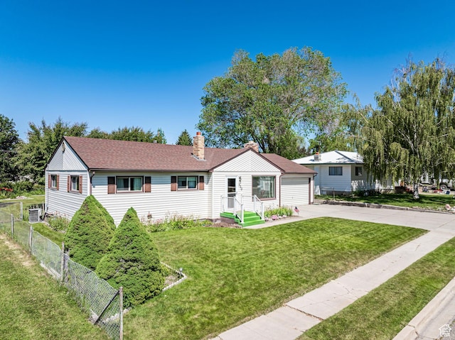 320 S 2nd St W, Soda Springs, ID 83276 - view of front of home featuring a chimney, a garage, concrete driveway, and a shingled roof