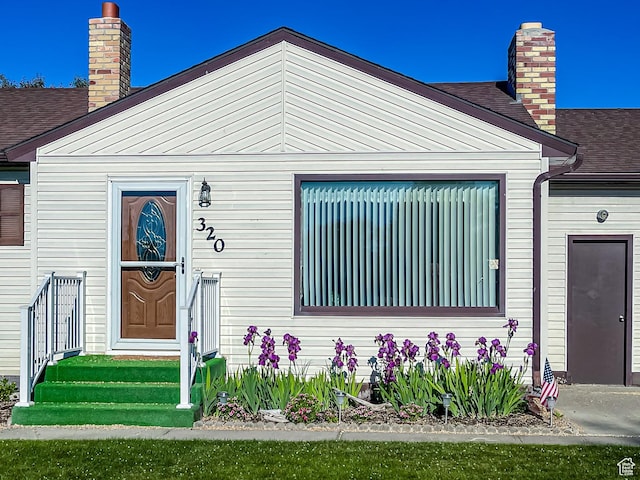 320 S 2nd St W, Soda Springs, ID 83276 - view of front facade with a chimney and a shingled roof