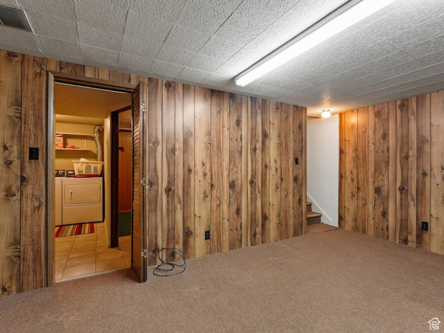 320 S 2nd St W, Soda Springs, ID 83276 - finished below grade area with washer and dryer, wooden walls, carpet flooring, and stairs