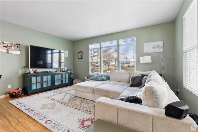 5023 W Currant Dr S, South Jordan, UT 84009 - living area featuring wood finished floors and plenty of natural light