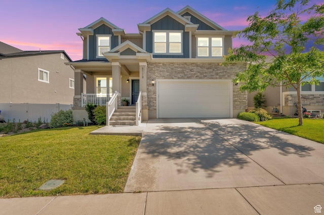 6729 W Dry Peak Dr, Herriman, UT 84096 - craftsman-style home featuring covered porch, concrete driveway, a garage, stucco siding, and stone siding
