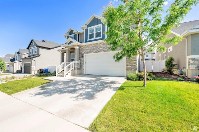 6729 W Dry Peak Dr, Herriman, UT 84096 - view of front of property featuring stone siding, a garage, driveway, a residential view, and stucco siding