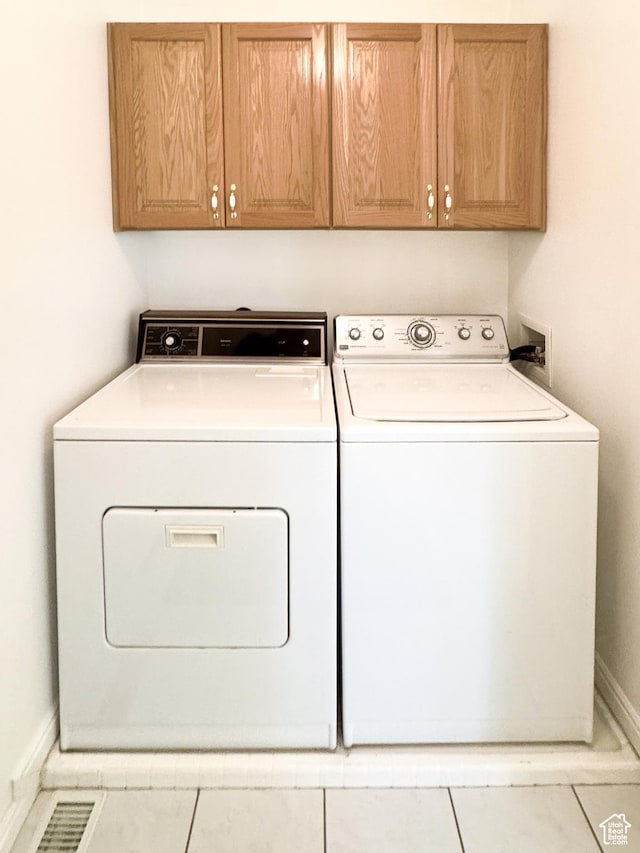 2187 N 3900 W, Plain City, UT 84404 - laundry room featuring cabinet space, washing machine and dryer, and tile patterned floors