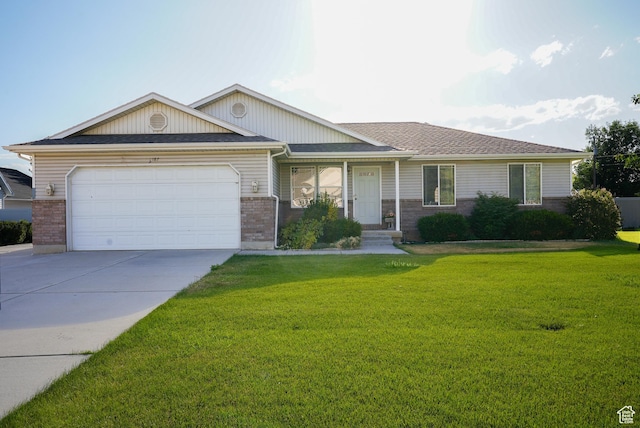 2187 N 3900 W, Plain City, UT 84404 - view of front of home with brick siding, a front yard, an attached garage, and concrete driveway