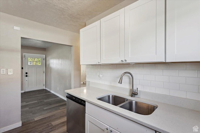 2692 S Monroe Blvd E, Ogden, UT 84401 - kitchen featuring dishwasher, light countertops, white cabinetry, dark wood-style floors, and tasteful backsplash
