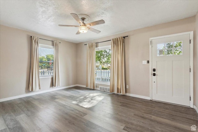 2692 S Monroe Blvd E, Ogden, UT 84401 - entrance foyer with wood finished floors, a ceiling fan, and a textured ceiling