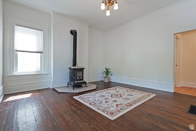 662 E 4th Ave, Salt Lake City, UT 84103 - living room featuring hardwood / wood-style flooring, crown molding, and a wood stove