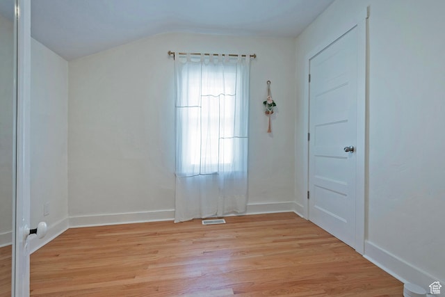 662 E 4th Ave, Salt Lake City, UT 84103 - unfurnished room with light wood-style flooring and lofted ceiling