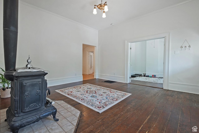 662 E 4th Ave, Salt Lake City, UT 84103 - living room with a wood stove, hardwood / wood-style floors, and crown molding