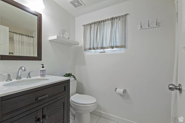 662 E 4th Ave, Salt Lake City, UT 84103 - bathroom with vanity and tile patterned flooring