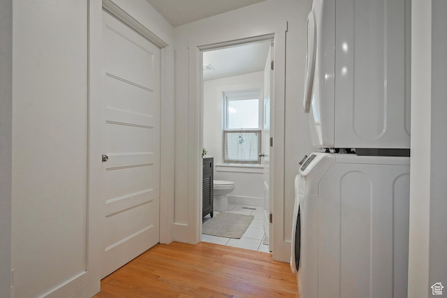 662 E 4th Ave, Salt Lake City, UT 84103 - washroom with stacked washer / dryer and light wood-style floors