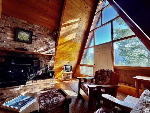 10215 E Moose Rd Unit 1, Brighton, UT 84121 - living area featuring wood walls, a high ceiling, wood finished floors, and a fireplace