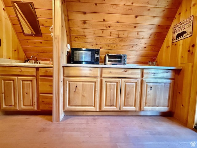 10215 E Moose Rd Unit 1, Brighton, UT 84121 - kitchen with black microwave, lofted ceiling, wooden walls, wood ceiling, and light countertops