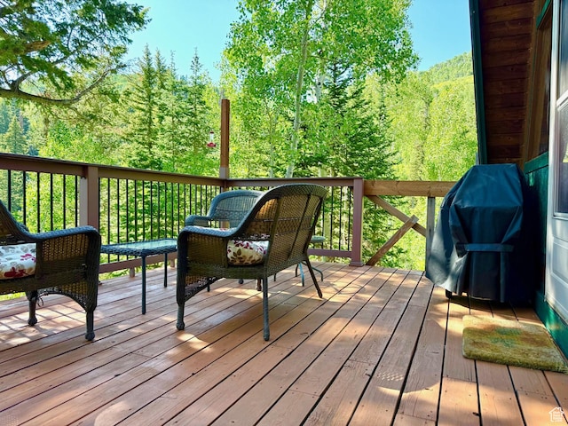 10215 E Moose Rd Unit 1, Brighton, UT 84121 - wooden terrace with a forest view and area for grilling