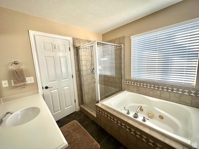 2242 N 2500 W, Lehi, UT 84043 - bathroom with a whirlpool tub, a stall shower, a textured ceiling, tile patterned floors, and vanity