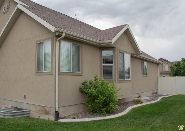 2242 N 2500 W, Lehi, UT 84043 - view of home's exterior featuring roof with shingles and stucco siding