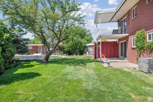 2270 E Murray Holladay Rd S Unit 4, Holladay, UT 84117 - view of grassy yard featuring a balcony