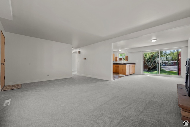 2270 E Murray Holladay Rd S Unit 4, Holladay, UT 84117 - unfurnished living room with light colored carpet and baseboards