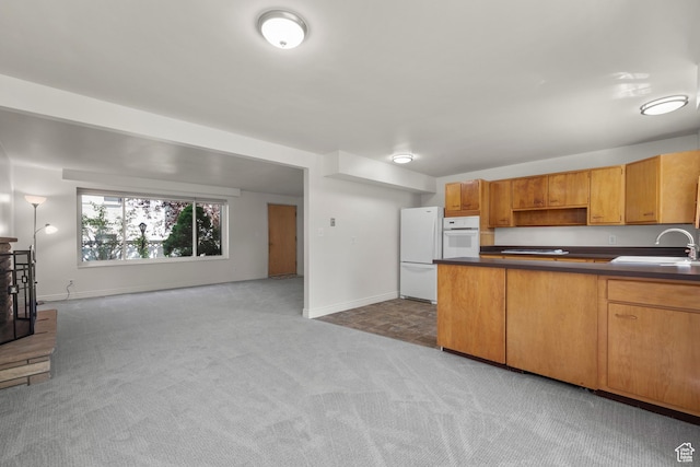 2270 E Murray Holladay Rd S Unit 4, Holladay, UT 84117 - kitchen with white appliances, light carpet, open floor plan, and dark countertops