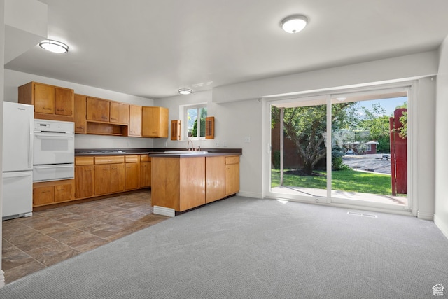 2270 E Murray Holladay Rd S Unit 4, Holladay, UT 84117 - kitchen featuring white appliances, a warming drawer, dark countertops, open shelves, and a peninsula
