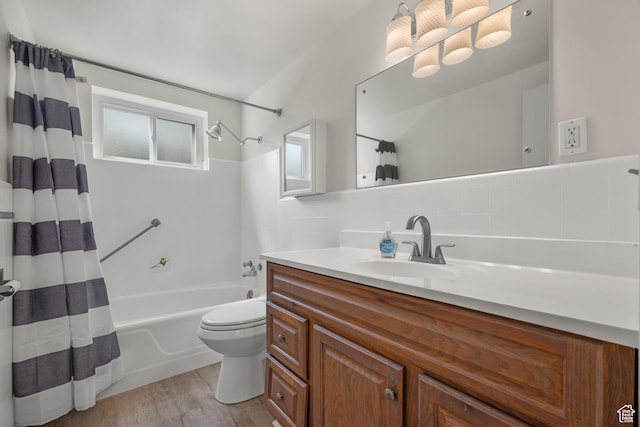 2270 E Murray Holladay Rd S Unit 4, Holladay, UT 84117 - full bathroom with shower / bath combo with shower curtain, vanity, wood finished floors, decorative backsplash, and lofted ceiling