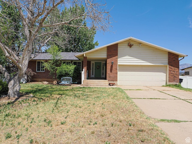 4060 W 2550 S, Taylor, UT 84401 - ranch-style house with a garage, driveway, brick siding, and a front yard