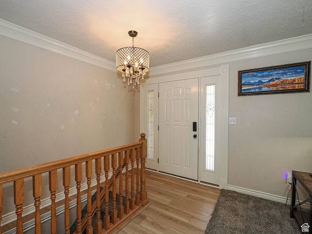 4060 W 2550 S, Taylor, UT 84401 - foyer with a chandelier, light wood finished floors, and ornamental molding