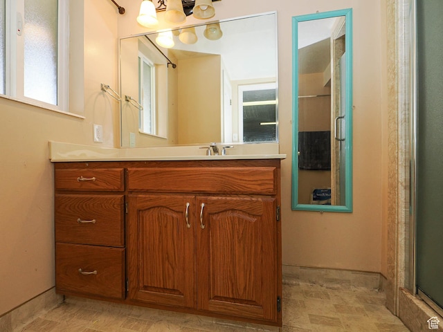 4060 W 2550 S, Taylor, UT 84401 - full bath featuring vanity, a chandelier, an enclosed shower, and tile patterned floors