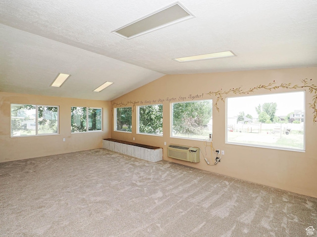 4060 W 2550 S, Taylor, UT 84401 - carpeted spare room featuring vaulted ceiling, a textured ceiling, and a wall mounted AC
