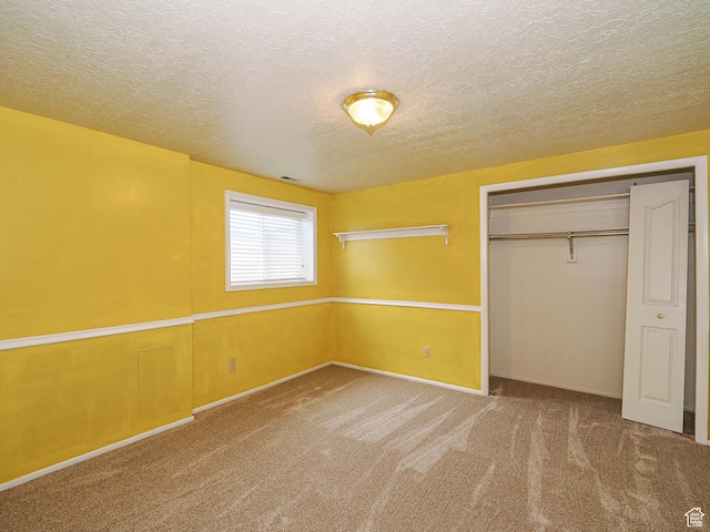 4060 W 2550 S, Taylor, UT 84401 - unfurnished bedroom with carpet floors, a textured ceiling, and a closet