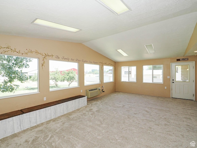 4060 W 2550 S, Taylor, UT 84401 - empty room with carpet floors, lofted ceiling, and a wall mounted air conditioner