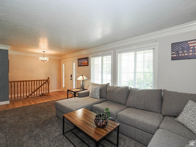 4060 W 2550 S, Taylor, UT 84401 - living room with crown molding, a chandelier, and wood finished floors