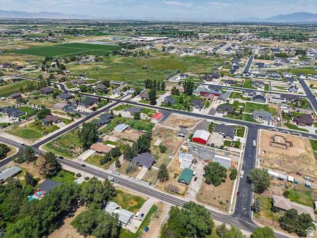 4060 W 2550 S, Taylor, UT 84401 - aerial overview of property's location featuring mountains and nearby suburban area