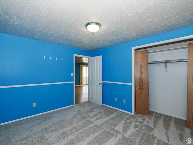 4060 W 2550 S, Taylor, UT 84401 - unfurnished bedroom featuring a closet, a textured ceiling, and carpet floors