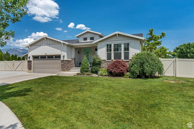 739 S 160 W, American Fork, UT 84003 - view of front facade with a gate, stone siding, a garage, and concrete driveway