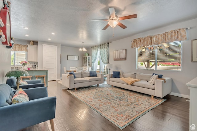 739 S 160 W, American Fork, UT 84003 - living area with healthy amount of natural light, a ceiling fan, recessed lighting, a textured ceiling, and dark wood-style floors