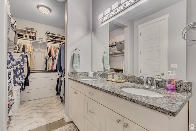 739 S 160 W, American Fork, UT 84003 - full bathroom featuring double vanity, a spacious closet, and wood finished floors