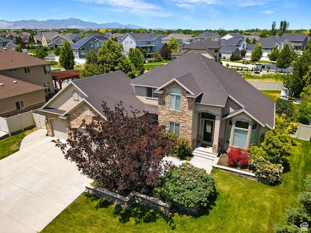 3072 W Current Creek Dr, South Jordan, UT 84095 - view of front of property featuring stone siding, a residential view, driveway, a shingled roof, and a mountain view