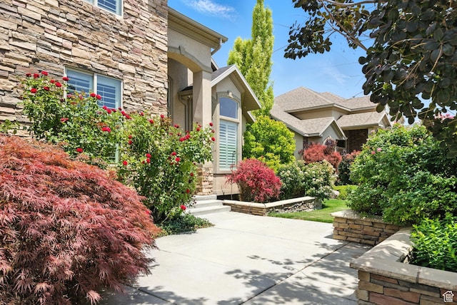 3072 W Current Creek Dr, South Jordan, UT 84095 - doorway to property with stone siding and stucco siding
