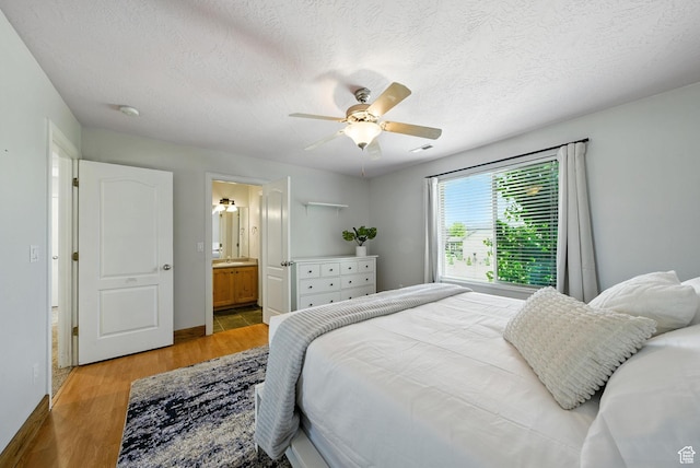 3072 W Current Creek Dr, South Jordan, UT 84095 - bedroom with light wood finished floors, a textured ceiling, ceiling fan, and ensuite bath